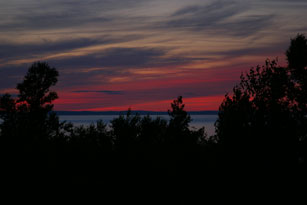 Devil's Island Sunset through the trees